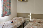 Campsite Cisano San Vito Mobile Home Turchese Interior Bedroom Single Beds 